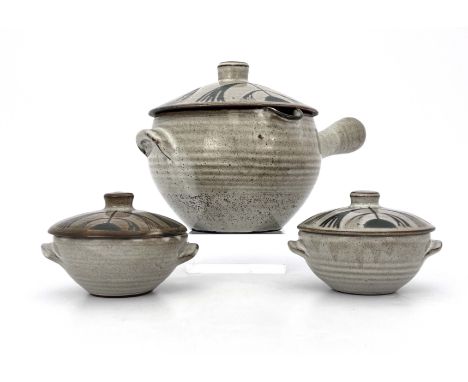 David Leach, a studio pottery soup tureen and cover with two lidded bowls, decorated in wax resist with stylised floral motif