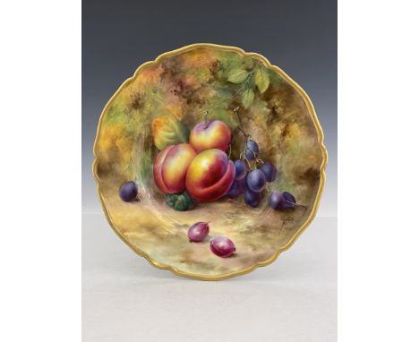 K M Price for Royal Worcester, a fruit painted plate, circa 1930s, decorated with plums, damsons and pink gooseberries on a m