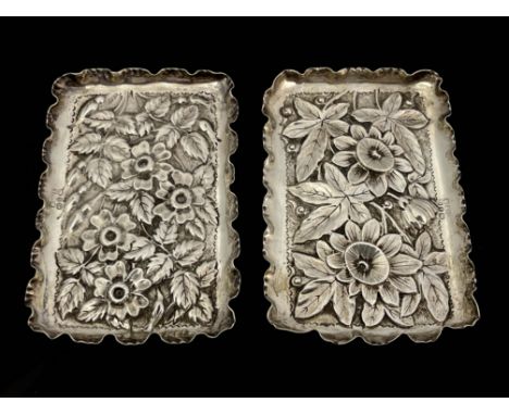 Two silver rectangular dishes, makers mark M &amp; L, Birmingham 1890, both with embossed and chased floral designs and crimp