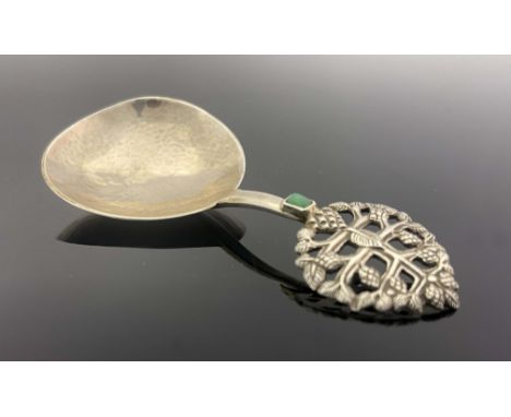 Edward Spencer for Artificers Guild, an Arts and Crafts silver and stone set caddy spoon, London 1924, planished pear shaped 