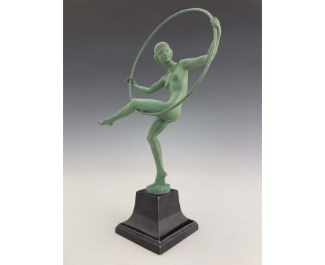 Marcel Bouraine for Le Verrier, Hoop Dancer, an Art Deco patinated art metal figure, circa 1925, modelled as a nude woman wit