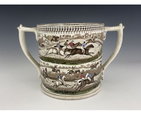 A large Staffordshire twin handled loving cup, J &amp; R. Godwin, transfer printed steeple chase design hand coloured, 34cm w