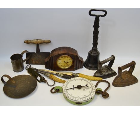 An early 19th century door porter; early 20th century oak mantel clock; 19th century dough cutter; flat irons; Salter scales,