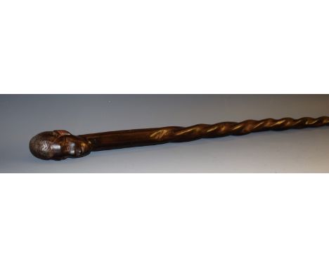 Tribal Art - a Zulu two-tone hardwood status stick or staff, the pommel carved as the head of a tribesmen, spirally wrythern 