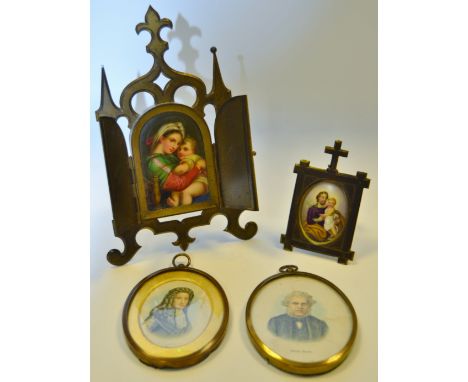A 19th century continental painted porcelain oval miniature plaque of a father and son, gilded easel frame surmounted by Corp