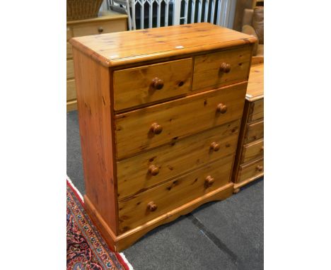 A pine chest of two short above three long drawers, bracket feet