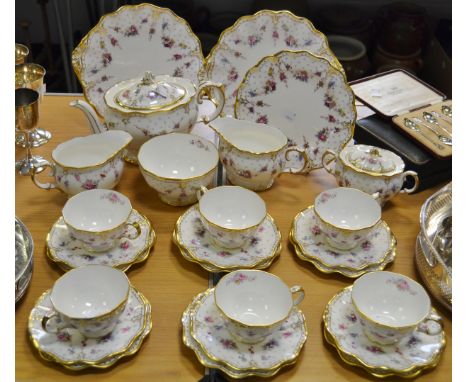 A Royal Crown Derby Royal Antionette pattern tea service for six, comprising of cups, saucers, side plates, teapot, milk  and