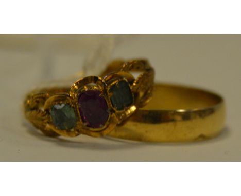 A 9ct gold wedding ring, 2.2g; a 9ct gold three stone ring