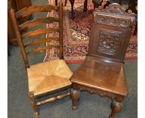 A 19th century oak refectory chair profusely carved throughout, boldly carved and turned; a 19th century elm and ash rush sea