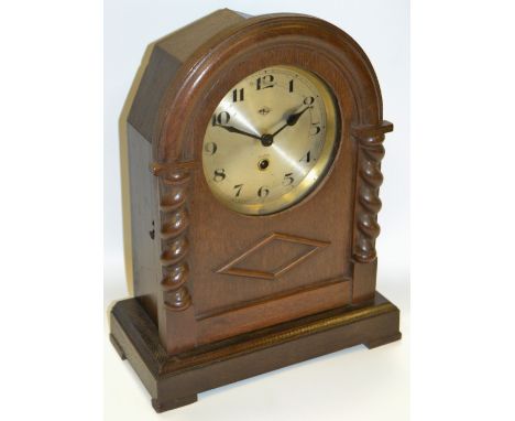 An oak cased mantel clock, silvered dial, Arabic numerals, c.1930