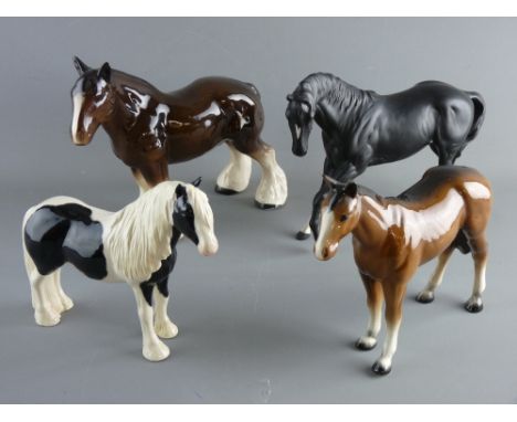 FOUR POTTERY HORSES by Beswick, Royal Doulton and others including a boxed John Beswick black and white horse, a Royal Doulto