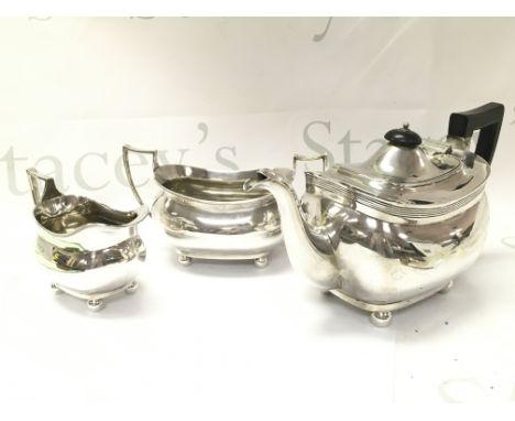 Three piece silver tea set including a teapot, milk jug and sugar bowl. Postage category C