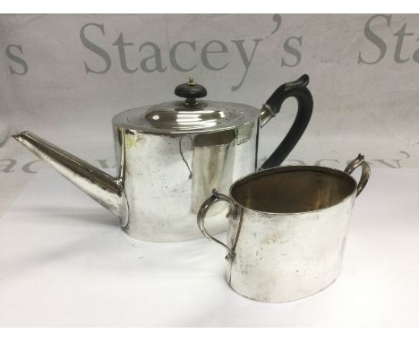 A silver teapot and sugar bowl, London hallmarks (2). Shipping category B.