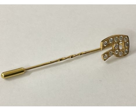 18ct gold, 3/4ct diamond inset initial tie pin, approx 4.09g, postage category A.