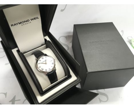 A boxed as new Gents Raymond Weil watch. Postage category b