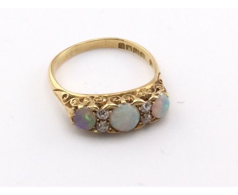 An 18ct Edwardian opal and diamond set ring. 4.33g and size O