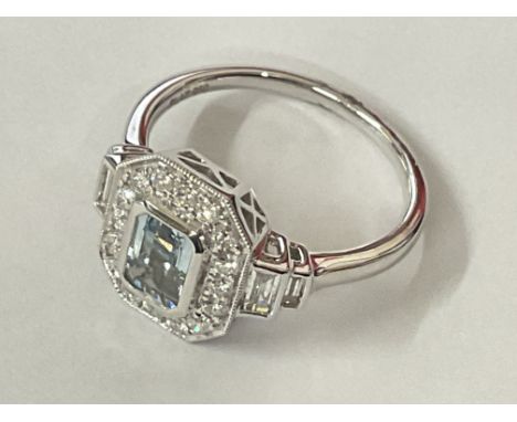 Platinum art deco style ring set with central step cut aquamarine and RBC and baguette cut diamonds. Aquamarine 0.82ct. Diamo