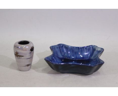 Poole, Portmadoc - A Poole Pottery oil coloured small vase. A Portmadoc dark blue bowl. Vase is 10 cm (h). (This does not con