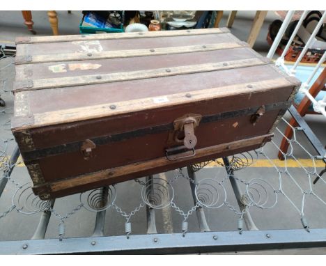 Antique travel trunk with wooden bounds 