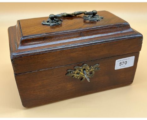 Antique mahogany tea caddy with lead liner. Fitted with an ornate brass handle and comes with key. [13x22x12.5cm] 