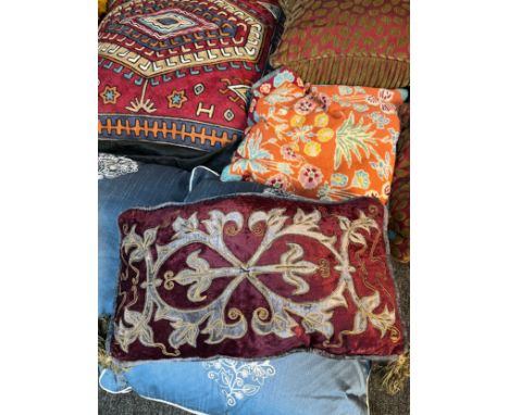 Collection of vintage feather filled cushions, includes various tapestry worked cushions. 
