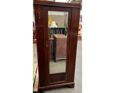 Late 19th century wardrobe, [John Taylor &amp; Son, Edinburgh] the top with inlaid frieze above a single mirrored door openin