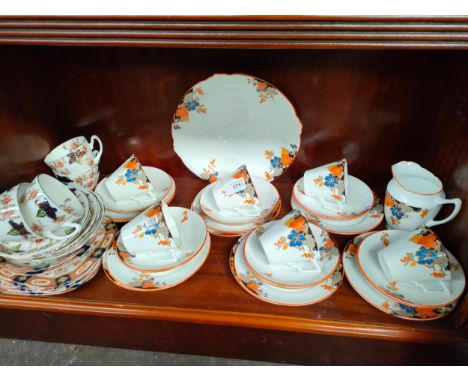 Art deco tea service together with odd cups and sausers 