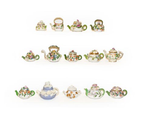 A quantity of mainly 19th century English porcelain miniature teapots, all decorated with applied flowers, including Minton e