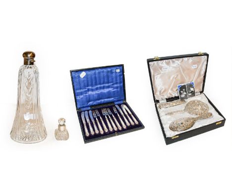 Cased silver three-piece dressing table set, a cased set of six silver handled cake knives and forks, a Walker and Hall silve