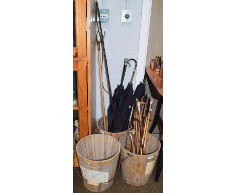 Twelve antler handled and other riding crops, some silver mounted, together with a military swagger stick, three walking stic