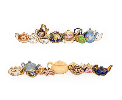 A collection of mainly 19th century English miniature teapots including Derby, Masons, Davenport, Wedgwood Jasperware and Spo