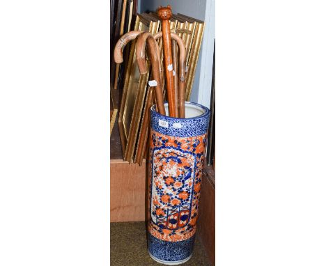 An early 20th century Japanese Imari stick stand, 61cm high, and five assorted walking sticks  .  Stand in good condition. Fr