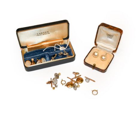 A pair of onyx cufflinks and two dress studs, stamped '9CT'; four mother-of-pearl buttons, stamped '9CT'; two cultured pearl 