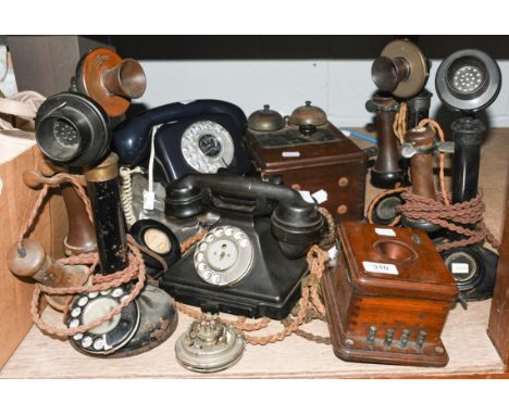 Four 1920s stick telephones, together with three bell boxes, another Bakelite telephone, and a telephone commemorating the Si