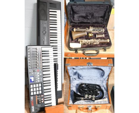 A Yamaha keyboard and an Akai keyboard, together with a cased clarinet, and a cased cornet