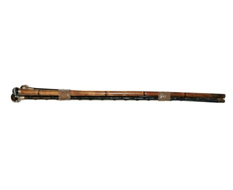 A silver mounted ebonised walking stick mounted with a tigers eye orb, together with a bamboo walking stick, with spherical a