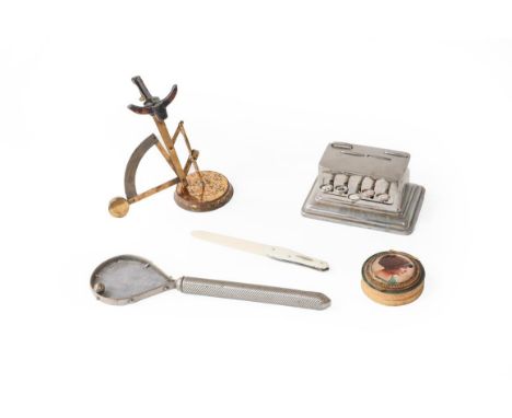 A collection of items, including: a novelty metal cheroot holder modelled as a tennis racket; a chrome mechanical playing car