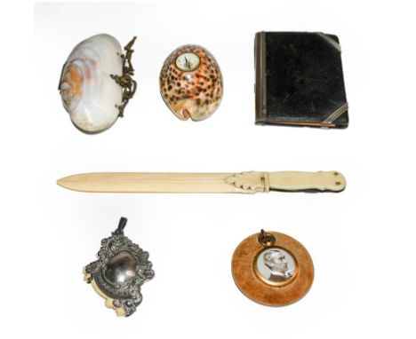 A collection of items, including: an aide memoire with writing tablet, pencil day and date feature, letter opener with two st