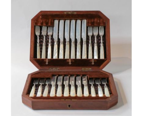 A set of twelve Victorian silver fruit knives with mother of pearl handles by James Deakin &amp; Sons and in fitted walnut ca