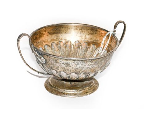 An Edward VII silver bowl, by the Goldsmiths and Silversmiths Co. Ltd., London, 1903, circular and with fluted lower body, on