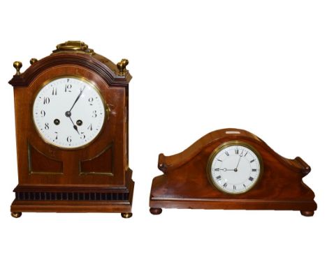 A mahogany eight day table clock, early 20th century with brass mounts, finials and button feet having enamel dial and striki