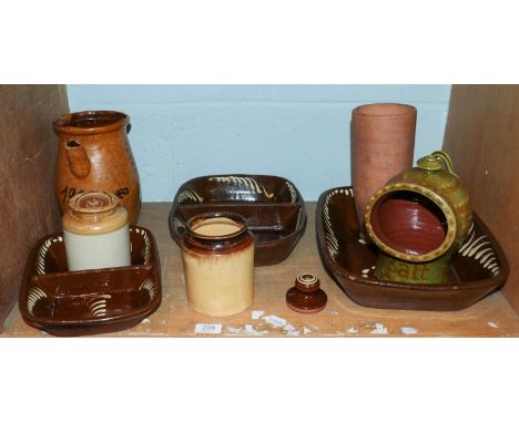 A quantity of slipware and other country pottery, including: three two-division rectangular dishes, an inkwell, a salt pig, a