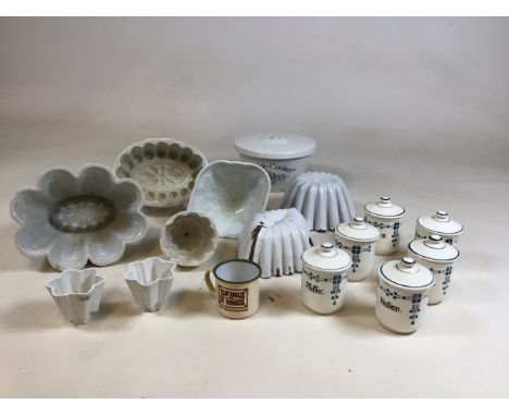 A collection of vintage ceramic and enamel jelly moulds together with a set of European spice pots. Two jelly moulds signed S