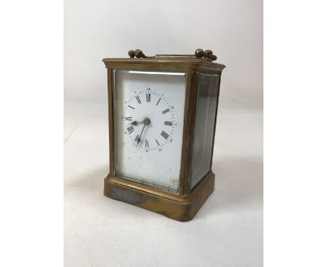 A french brass carriage clock with in bevelled glass case. Untested and some chips to glass W:9cm x D:8cm x H:13cm