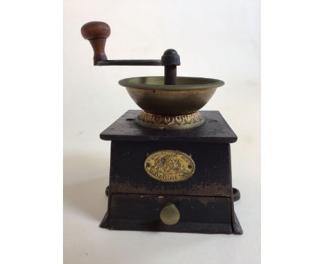 A metal Kendrick and son vintage hand coffee grinder