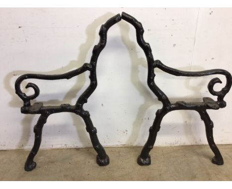 A pair of painted coalbrookdale style bench ends. 