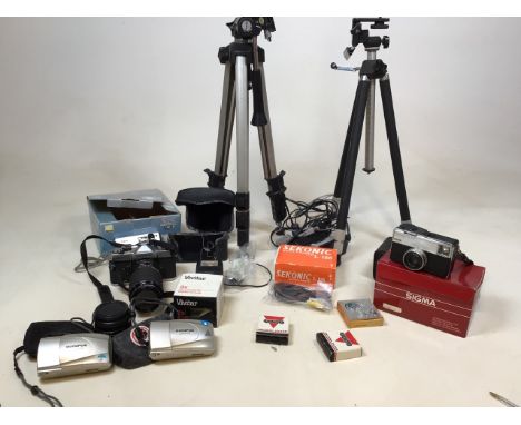 A collection of cameras - all untested - including a Fujica STX1, a Nikon Coolpix, a Kodak Instamatic 233, two Olympus Stylus