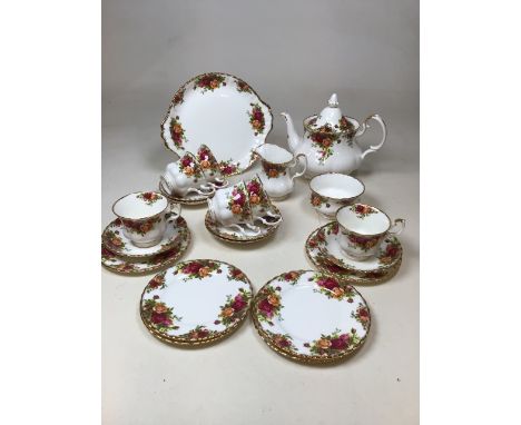 Royal Albert  Old Country Roses Tea Set. Includes cake plate, large tea pot, six cups and saucers and tea plates, milk jug an