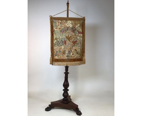 A Victorian mahogany pole screen with hand embroidered tapestry. W:46cm x H:136cm