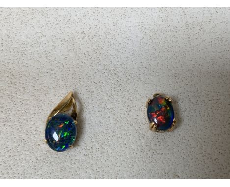 A doublet opal pendant set in 18ct gold approx 1cm length, together with another pendant with doublet opal set in gold colour